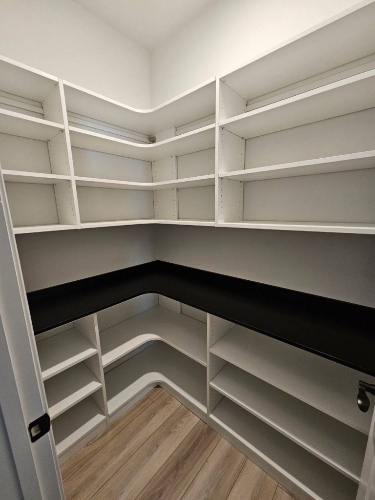 Pantry with Black Countertop and Backsplash min